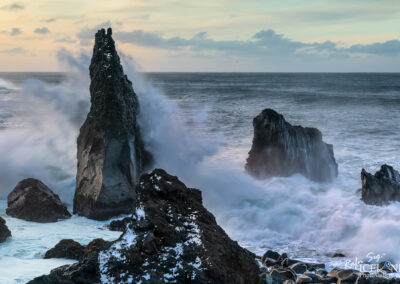 Waves smashing on pilars of Rock in Iceland coast
