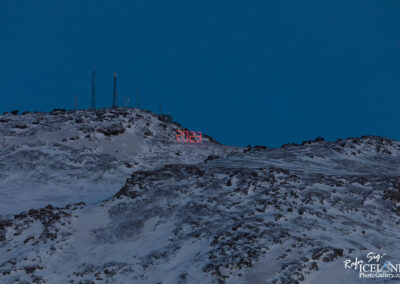 Large illuminated 2023 sign at the top of the mountain Þorbjörn