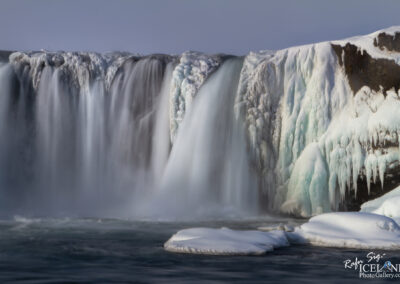 Frozen waterfall, capturing the essence of Iceland's unique winter landscape.