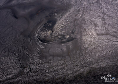 A black lava crater in Iceland, illustrating the power of nature's elements.