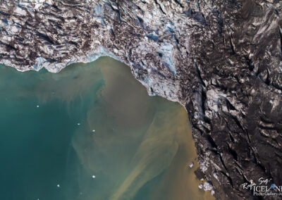 A stunning aerial perspective of Earth, highlighting the contrast between tranquil waters and Ice edge from a glacier