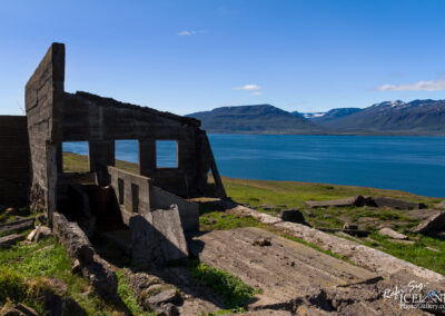 An old, abandoned building in Iceland, surrounded by rugged terrain, reflecting the beauty of decay in a remote setting.