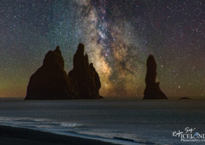 The Milky Way shines brightly over Iceland's sea stacks, offering a mesmerizing display of stars against the dark ocean.